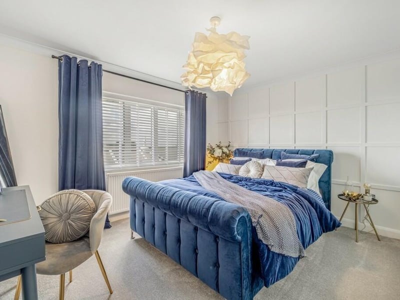 One of the three other bedrooms.
