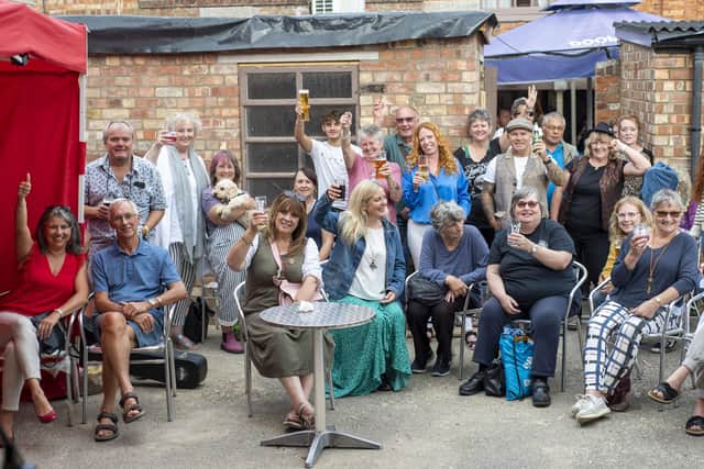 Revellers cheering on the bands. Photo: Holly Parkinson