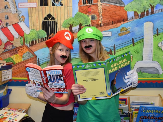 Two Super Mario fans enjoy a book at Park Academy.