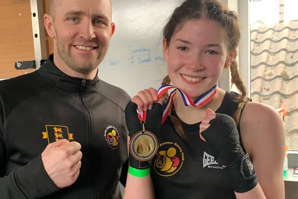 Amber Barry shows off her winners medal after a fine performance on Sunday afternoon.