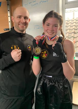 Amber Barry shows off her winners medal after a fine performance on Sunday afternoon.