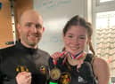 Amber Barry shows off her winners medal after a fine performance on Sunday afternoon.