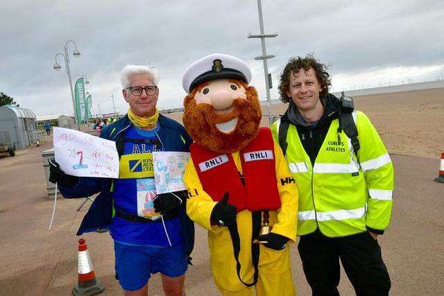 Alan Gregory of Winterton Running Club  with the RNLI mascot and organiser of the race  Jono 'Curly' Frary.