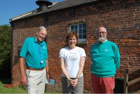 Victoria Atkins MP (centre) being shown around the Dogdyke engines by volunteer Norman Groom and chairman of trustees David Start.