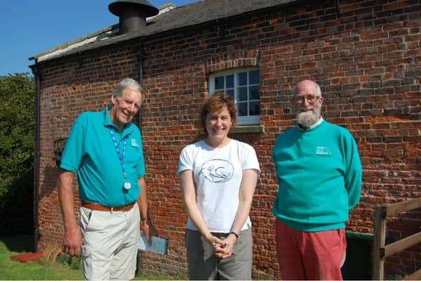 Victoria Atkins MP (centre) being shown around the Dogdyke engines by volunteer Norman Groom and chairman of trustees David Start.
