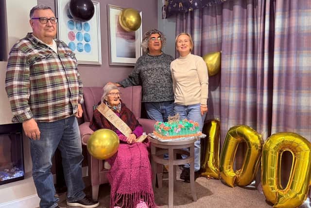 Katriye Sefkat Ariel, of Sleaford Hall care home, marking her 100th birthday with her family.