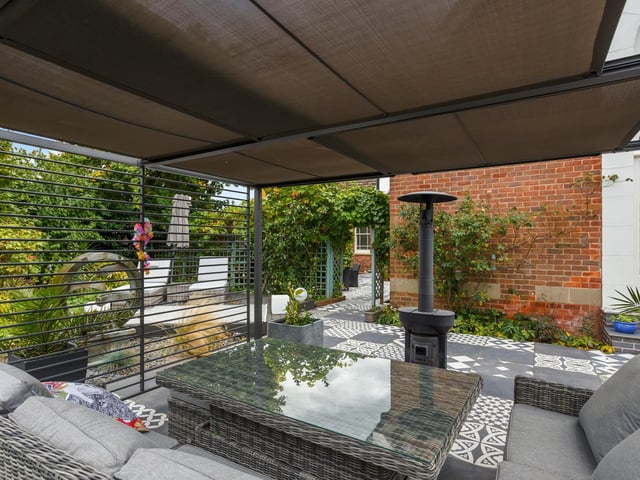 A covered outdoor lounge area.