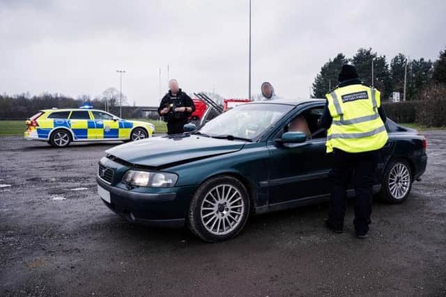 Immigration enforcement and police officers checking documents during Operation Foxtail around Sleaford. Photo: Lincs Police