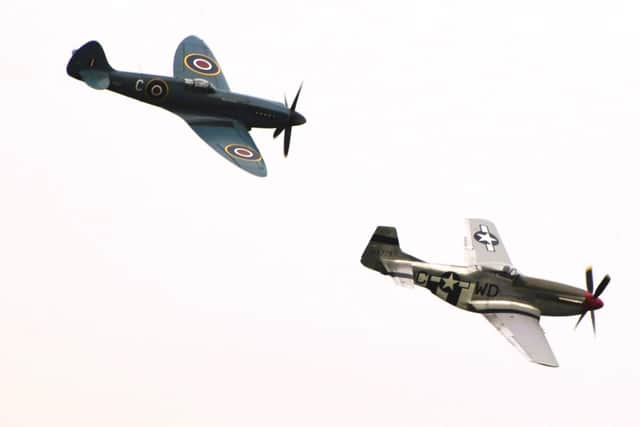 The flypast by a Spitfire and Mustang from The Rolls-Royce Heritage Flight.