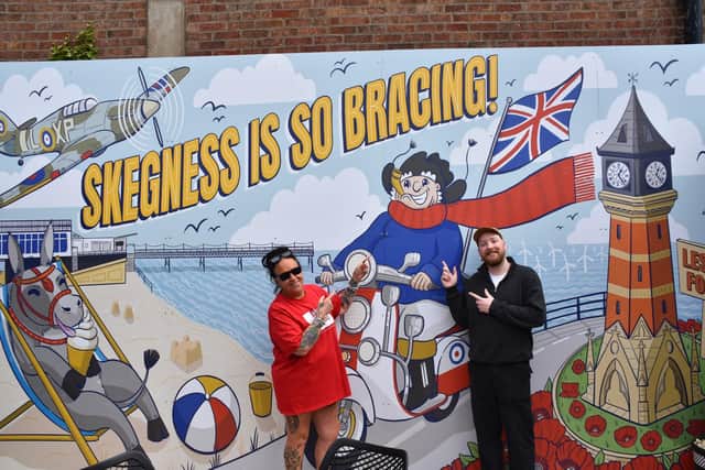 The Lumley manager Sally Smith celebrating completion of the mural with artist Dan Bangham. Photo: Barry Robinson.