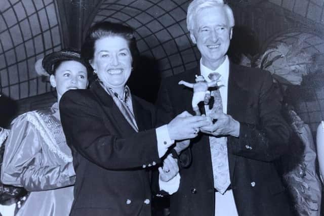 Janice Suton is presented with a Jolly Fisherman statuette by former ELDC Director of Entertainment, the late Leslie Shepherd.