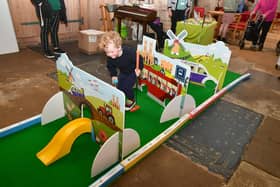 Henry Evans 4 of Louth, enjoying the mini golf on the Lincolnshire County Council's Call Connect stall in St Andrews Church