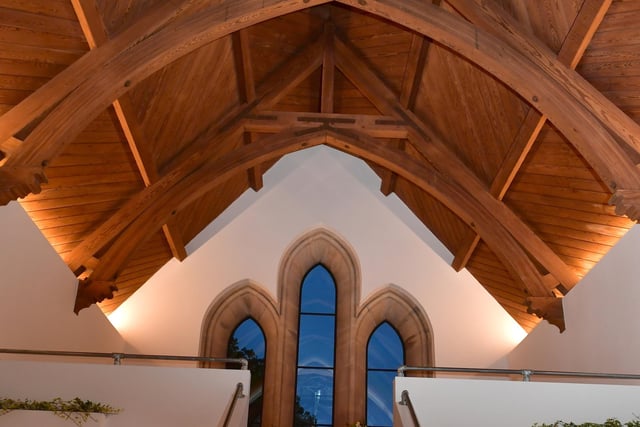 A view of one of the mezzanine areas and the beamed roof space. Photo: David Dawson