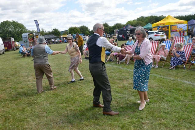 Dancing to 1940s tunes.