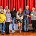 Louth community pantomime club handing over £800 to Hayley Hodson from Mimi's Mission from the proceeds of Robin Hood - The Panto.