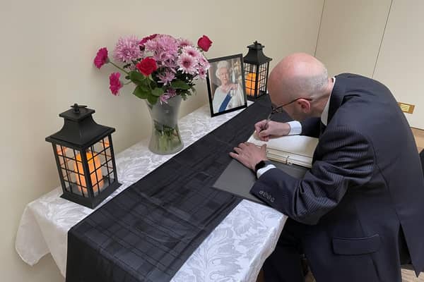 Caistor's Deputy Mayor, Coun Steve Gaughan signing the Book of Condolence