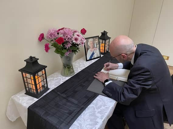 Caistor's Deputy Mayor, Coun Steve Gaughan signing the Book of Condolence