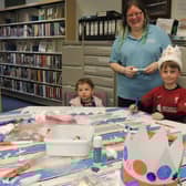 Coronation crown craft session led by Sleaford library assistant Stephanie Pleasance, with Olivia Lanzon, aged one, of Ruskington and Dexter Keep, aged seven, of Sleaford.