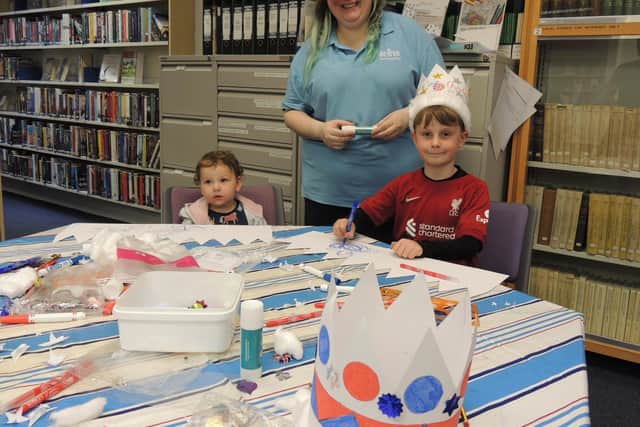 Coronation crown craft session led by Sleaford library assistant Stephanie Pleasance, with Olivia Lanzon, aged one, of Ruskington and Dexter Keep, aged seven, of Sleaford.