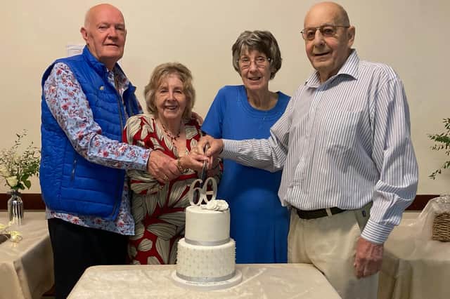A double diamond wedding celebration. Cutting the cake, from left - John and Patricia Ransome, with Pat and Terry Markham.