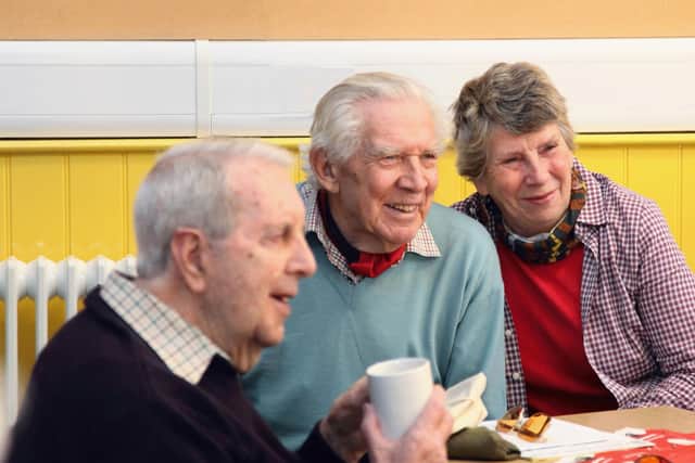 Macular Society support group members enjoy the social aspect of their monthly meetings.