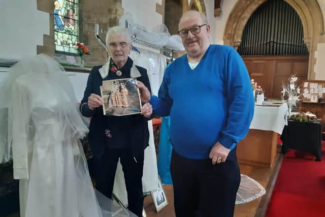 Joanna Stewart displays the wedding dress she wore 47years ago, which husband Stewart is sure would still fit.