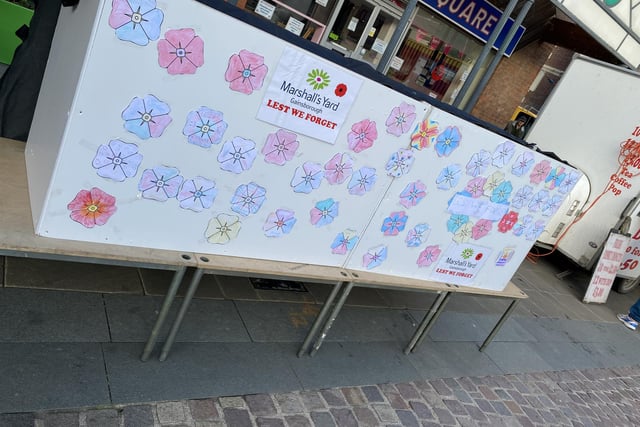 Children of all ages helped create poppies for a large display wall in Gainsborough Market Place