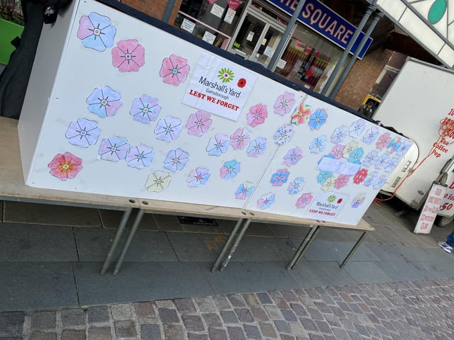 Children of all ages helped create poppies for a large display wall in Gainsborough Market Place