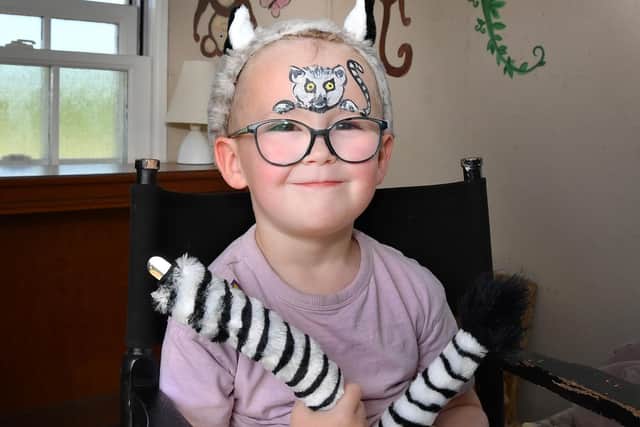 Harry Jennings shows off his lemur face paint.