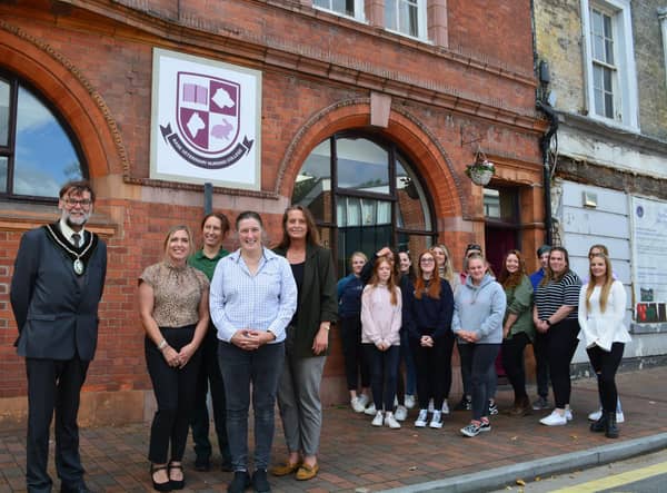 Students, thje college team and the Town Mayor outside the newly renovated building
