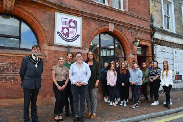 Students, thje college team and the Town Mayor outside the newly renovated building