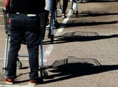 Shoppers queue using safe distance measures at Waitrose supermarket in Rushden, England (Photo: David Rogers/Getty Images)