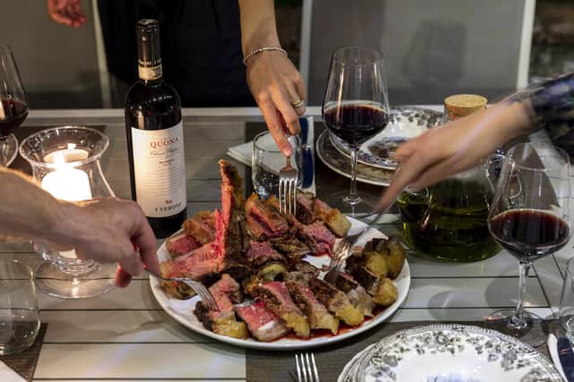A chef cooks outside at Bosco Ai Frati (photo: Francesca Anichini)