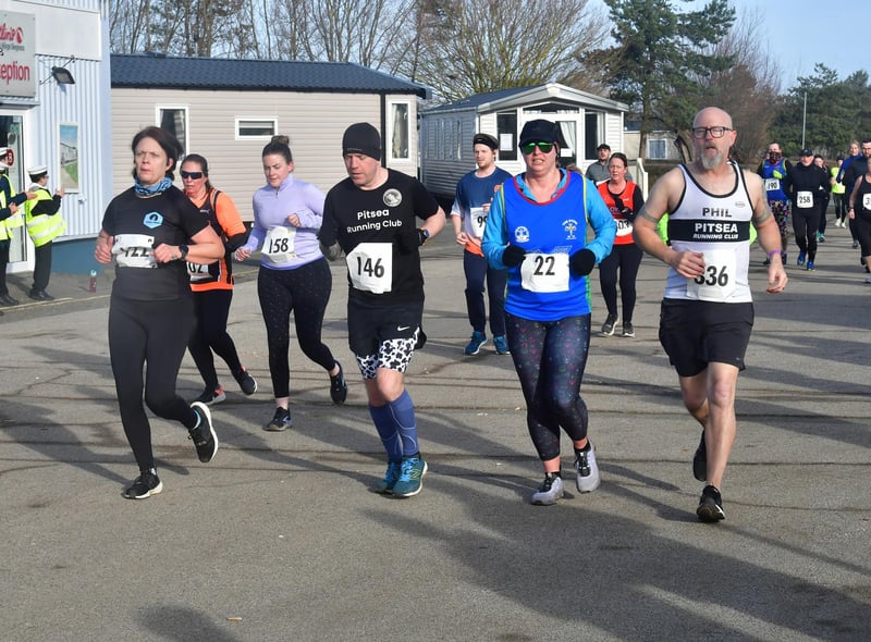 Runners doing a lap of the caravans.