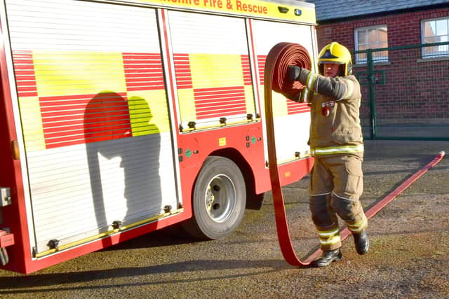 Demonstrating the hose reel is firefighter Justin Clayton at Horncastle fire station.