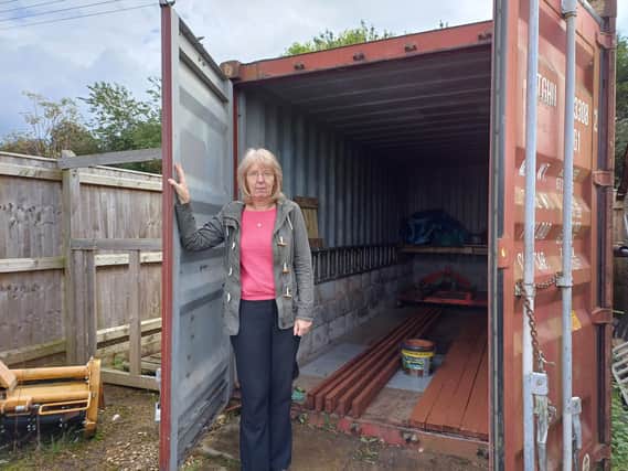 CEO and charity founder​ Pam Hodge at the empty storage container. Items estimated to total £20,000 were stolen last week. Image: Dianne Tuckett