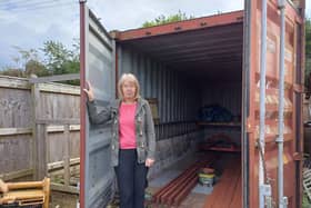 CEO and charity founder​ Pam Hodge at the empty storage container. Items estimated to total £20,000 were stolen last week. Image: Dianne Tuckett