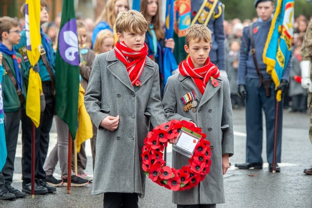 Greenwich House School's Year 6 pupils Edward Worthington and Freddie Price placing their wreaths.