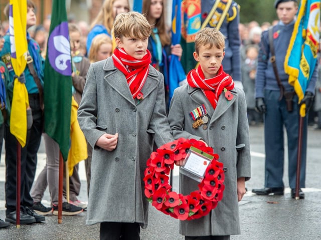 Greenwich House School's Year 6 pupils Edward Worthington and Freddie Price placing their wreaths.