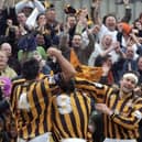 The Pilgrims celebrate Warburton's goal with supporters.