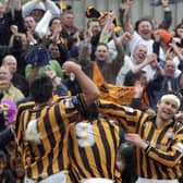 The Pilgrims celebrate Warburton's goal with supporters.