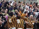 The Pilgrims celebrate Warburton's goal with supporters.