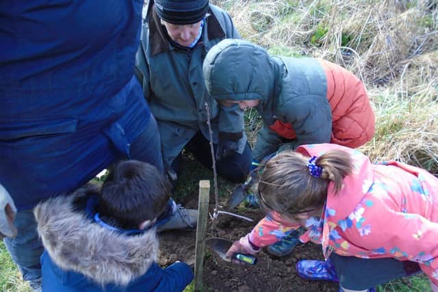 Children from Binbrook Primary School planting their community orchard