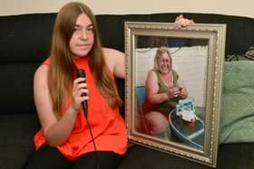 Charlotte Capindale with a photo of her auntie Donna.