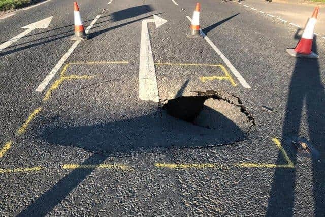 An image from when the road originally collapsed due to the faulty culvert under the A153.