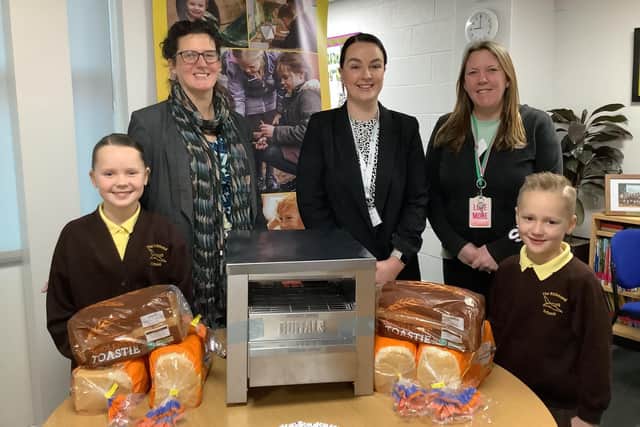 Headteacher Vicky Ross with Jorden Burton from Micronclean, Fran Worthington of the PFA and pupils Mila and Harry Burton.