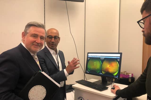 Tushar Majithia, from Lunettes Opticians, speaking to Barry Gardiner MP.