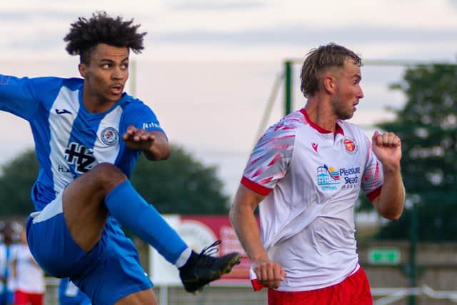 Jordan Nuthall is beaten to the ball as Holbeach's right back clears the ball for a throw. Photo by Ryan Thompson (Happy Snapz Photography).