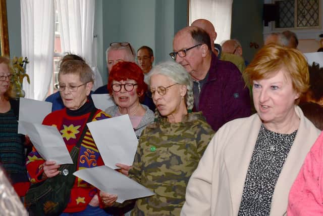 Singers learning a song 'A Message to you, Rishi'.