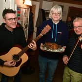 L-R Sean South, Tom Lane with the haggis, and Rick Alliwell, of the Higgledy Piggledy Band.